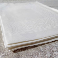 Load image into Gallery viewer, White Irish linen placemat with celtic weave