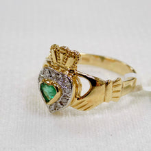 Load image into Gallery viewer, side view of ladies gold Claddagh ring with emerald and diamonds
