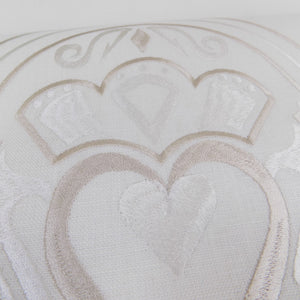 detail of irish linen runner with gold claddagh design