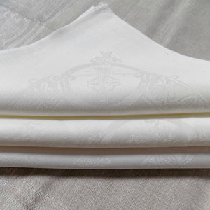 folded white Celtic Irish linen napkins