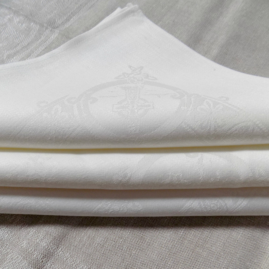 folded white Celtic Irish linen napkins